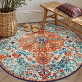 Covaba bohemian floral medallion round rug in amber clay, styled in a room setting