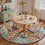 Covaba bohemian floral medallion round rug in amber clay, styled in a room setting, view 4