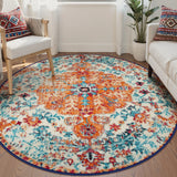 Covaba bohemian floral medallion round rug in amber clay, styled in a room setting, view 5
