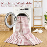 Covaba abstract rainbow stripe pink/white rug in blush clay, styled in a room setting