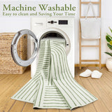 Covaba abstract rainbow stripe green/white rug in fern green, styled in a room setting