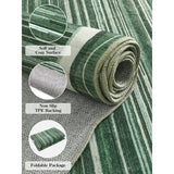 Covaba modern abstract bordered scalloped rug in fern green, shown flat on a plain ivory backdrop
