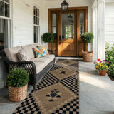 Covaba tribal soft easy jute indoor/outdoor runner rug in ink black, styled in a room setting, view 12