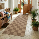 Covaba checkered easy jute indoor/outdoor runner rug in dune khaki, styled in a room setting