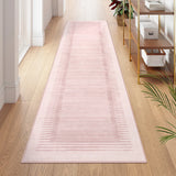 Covaba modern minimalist line runner rug in blush clay, styled in a room setting, view 3