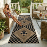 Covaba tribal soft easy jute indoor/outdoor runner rug in ink black, styled in a room setting, view 7