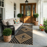 Covaba tribal soft easy jute indoor/outdoor runner rug in ink black, styled in a room setting, view 8
