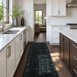 Covaba vintage persian distressed runner rug in ink black, styled in a room setting, view 5