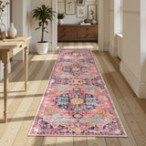 Covaba bohemian floral medallion runner rug in faded rose, styled in a room setting, view 4
