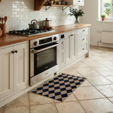 Covaba geometric checkered easy jute indoor/outdoor doormat in coffee brown, styled in a room setting, view 2