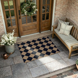 Covaba geometric checkered easy jute indoor/outdoor doormat in coffee brown, styled in a room setting