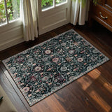 Covaba ultra-thin vintage floral moroccan trellis doormat in ink black, styled in a room setting, view 2