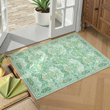 Covaba maximalism vintage french floral doormat in willow sage, styled in a room setting