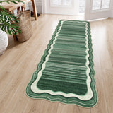 Covaba modern abstract bordered scalloped runner rug in fern green, styled in a room setting