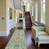 Covaba boho insect botanical floral runner rug in fern green, styled in a room setting, view 2