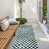 Covaba check soft easy jute black/white indoor/outdoor runner rug in soft white, styled in a room setting, view 6