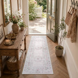 Covaba vintage traditional floral runner rug in blush clay, styled in a room setting, view 2