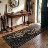 Covaba mystical snake runner rug in ink black, styled in a room setting, view 2