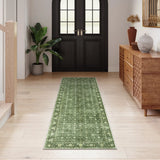 Covaba vintage persian distressed runner rug in fern green, styled in a room setting, view 2