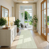 Covaba abstract rainbow stripe green/white runner rug in fern green, styled in a room setting, view 2