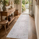 Covaba vintage traditional floral runner rug in blush clay, styled in a room setting, view 7