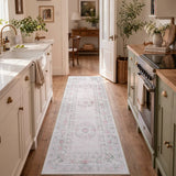 Covaba vintage traditional floral runner rug in blush clay, styled in a room setting, view 8