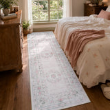 Covaba vintage traditional floral runner rug in blush clay, styled in a room setting, view 6