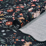 Covaba maximalist unicorn garden scalloped rug in ink black, styled in a room setting