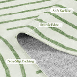 Covaba abstract rainbow stripe green/white rug in fern green, styled in a room setting, view 3