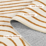 Covaba abstract rainbow stripe orange/white rug in amber clay, styled in a room setting