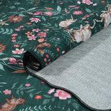 Covaba maximalist unicorn garden scalloped rug in forest fern, styled in a room setting, view 2