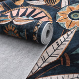 Covaba egyptian-inspired botanical rug in deep navy, styled in a room setting