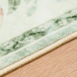 Covaba vintage floral rug in soft green, styled in a room setting, view 2