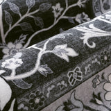 Covaba wild tiger rug in ink black, styled in a room setting