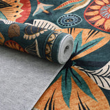 Covaba egyptian-inspired botanical rug in teal haze, styled in a room setting