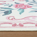 Covaba floral bows rug in blush clay, styled in a room setting