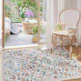 Covaba maximalism vibrant blossom floral area rug in warm beige, styled in a room setting, view 6