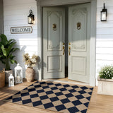 Covaba geometric checkered easy jute indoor/outdoor area rug in coffee brown, styled in a room setting, view 16