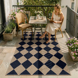 Covaba geometric checkered easy jute indoor/outdoor area rug in coffee brown, styled in a room setting, view 14