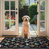 Covaba meadow floral area rug in ink black, styled in a room setting, view 11