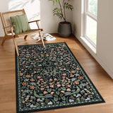 Covaba maximalism vibrant blossom floral area rug in ink black, styled in a room setting, view 12