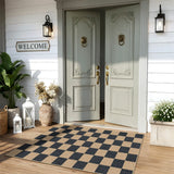 Covaba checkered easy jute natural indoor/outdoor area rug in ink black, styled in a room setting, view 14