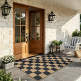 Covaba checkered easy jute natural indoor/outdoor area rug in ink black, styled in a room setting, view 15