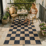 Covaba checkered easy jute natural indoor/outdoor area rug in ink black, styled in a room setting, view 13