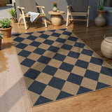 Covaba geometric checkered easy jute indoor/outdoor area rug in stormy blue, styled in a room setting, view 4