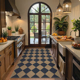 Covaba geometric checkered easy jute indoor/outdoor area rug in stormy blue, styled in a room setting, view 7
