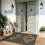 Covaba tribal soft easy jute indoor/outdoor area rug in ink black, styled in a room setting, view 4