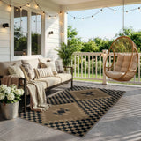 Covaba tribal soft easy jute indoor/outdoor area rug in ink black, styled in a room setting, view 2