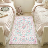 Covaba floral bows area rug in blush clay, styled in a room setting, view 4