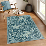 Covaba vintage woodcut forest and rabbit area rug in stormy blue, styled in a room setting, view 5